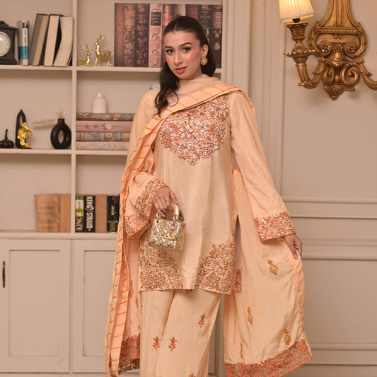 On pure tussle silk with hand embroidery and embellishment paired with block printed organza dupatta and flared pants