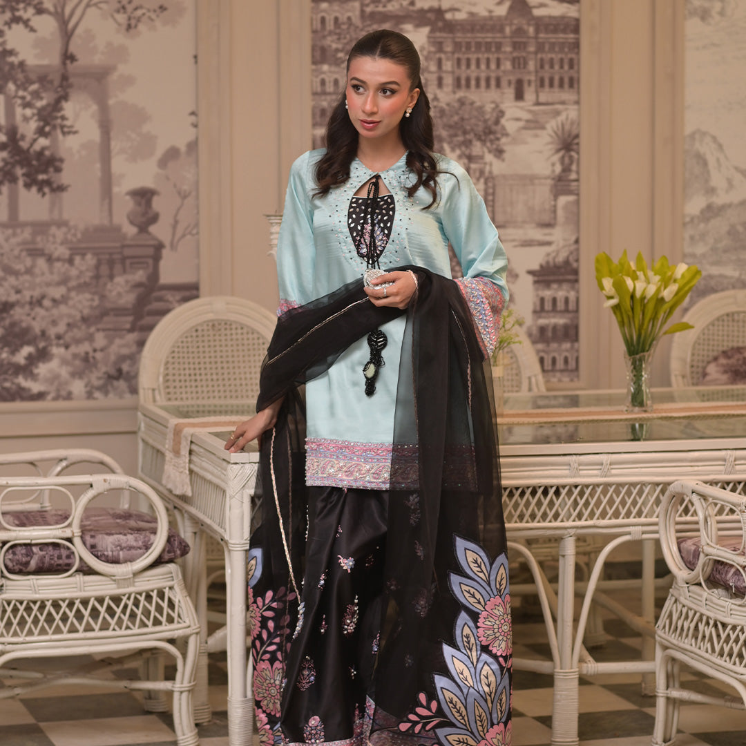 On pure shamoz silk with hand embellishments paired with black digital print hand embellished Farsi shalwar and organza dupatta. Dupatta has work also
