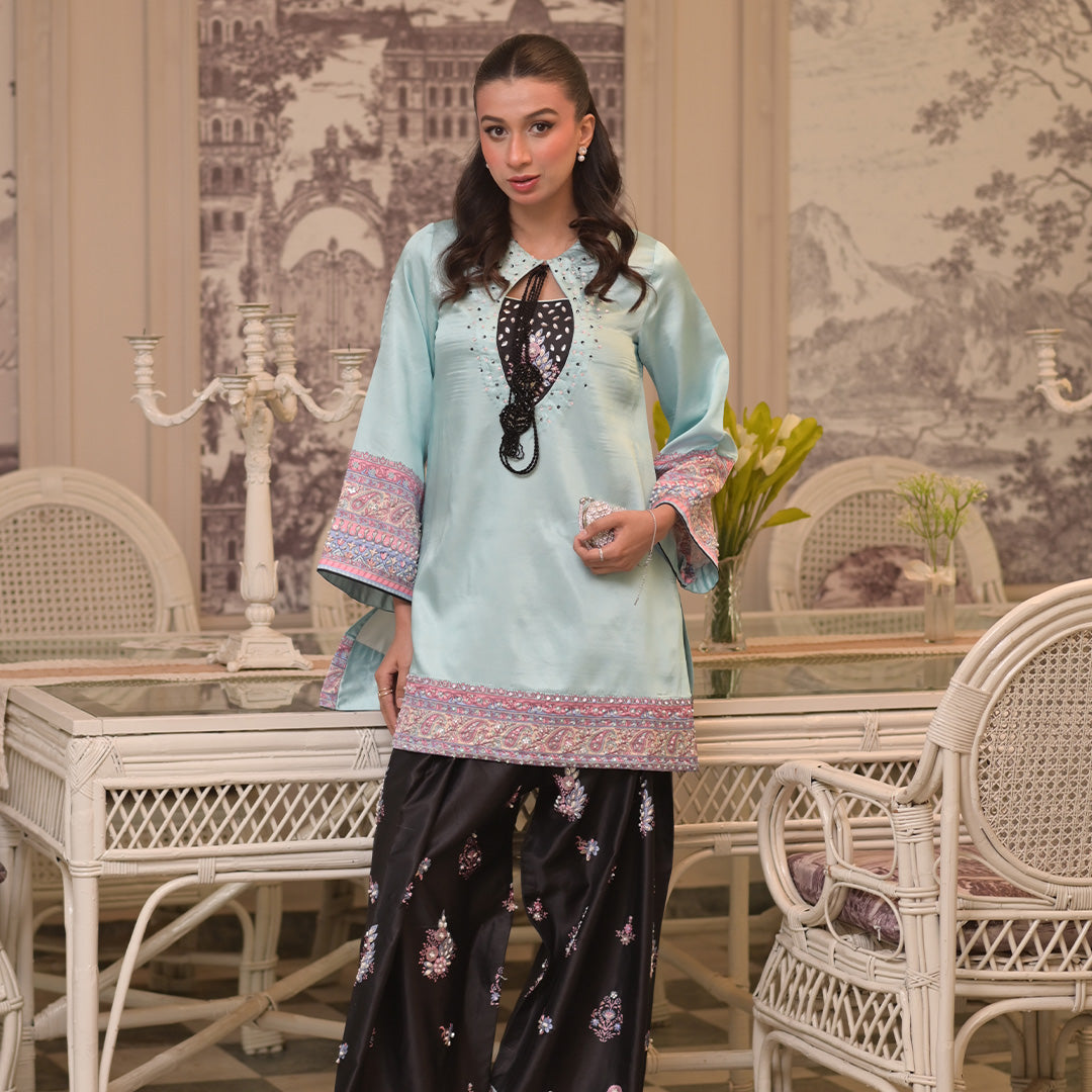 On pure shamoz silk with hand embellishments paired with black digital print hand embellished Farsi shalwar and organza dupatta. Dupatta has work also
