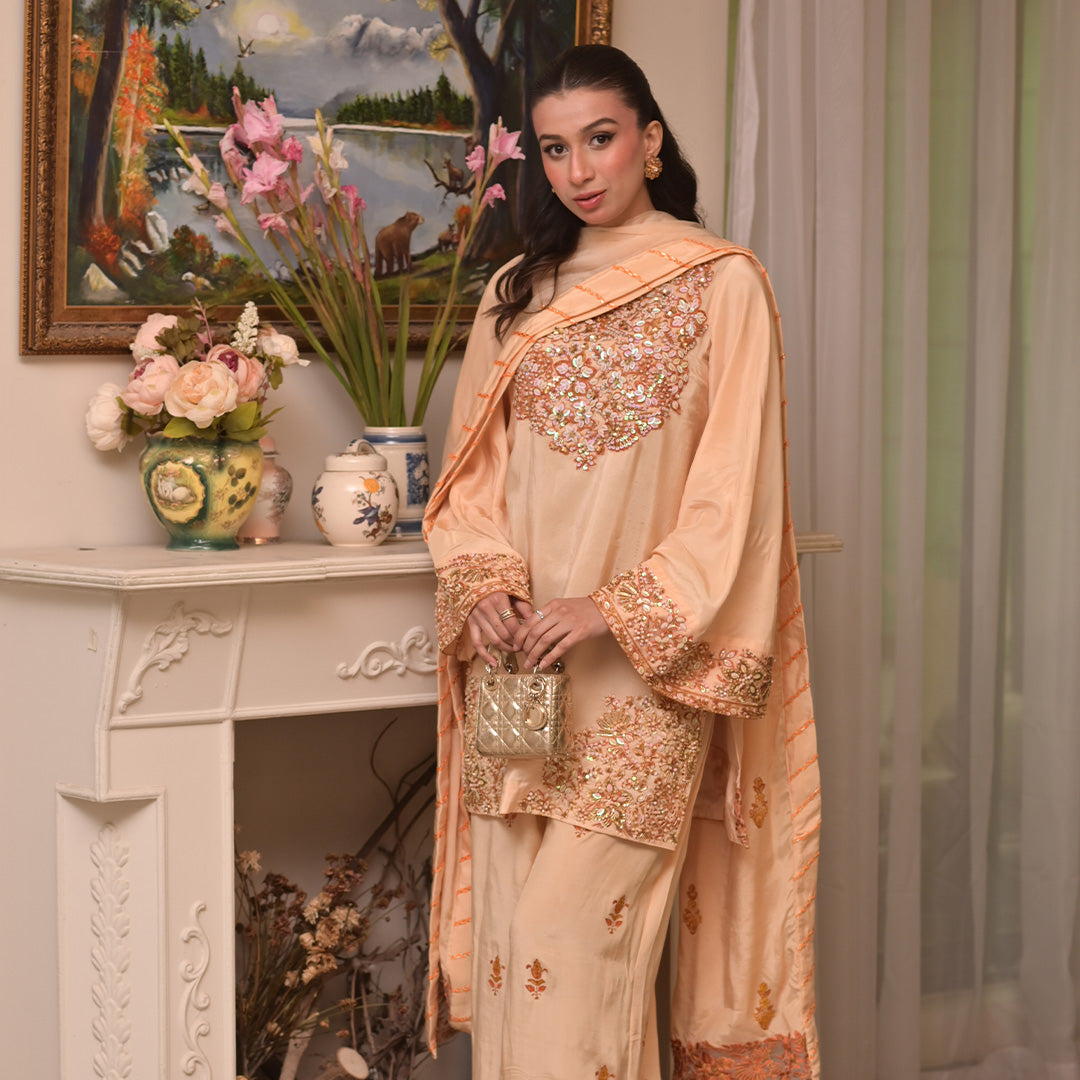 On pure tussle silk with hand embroidery and embellishment paired with block printed organza dupatta and flared pants