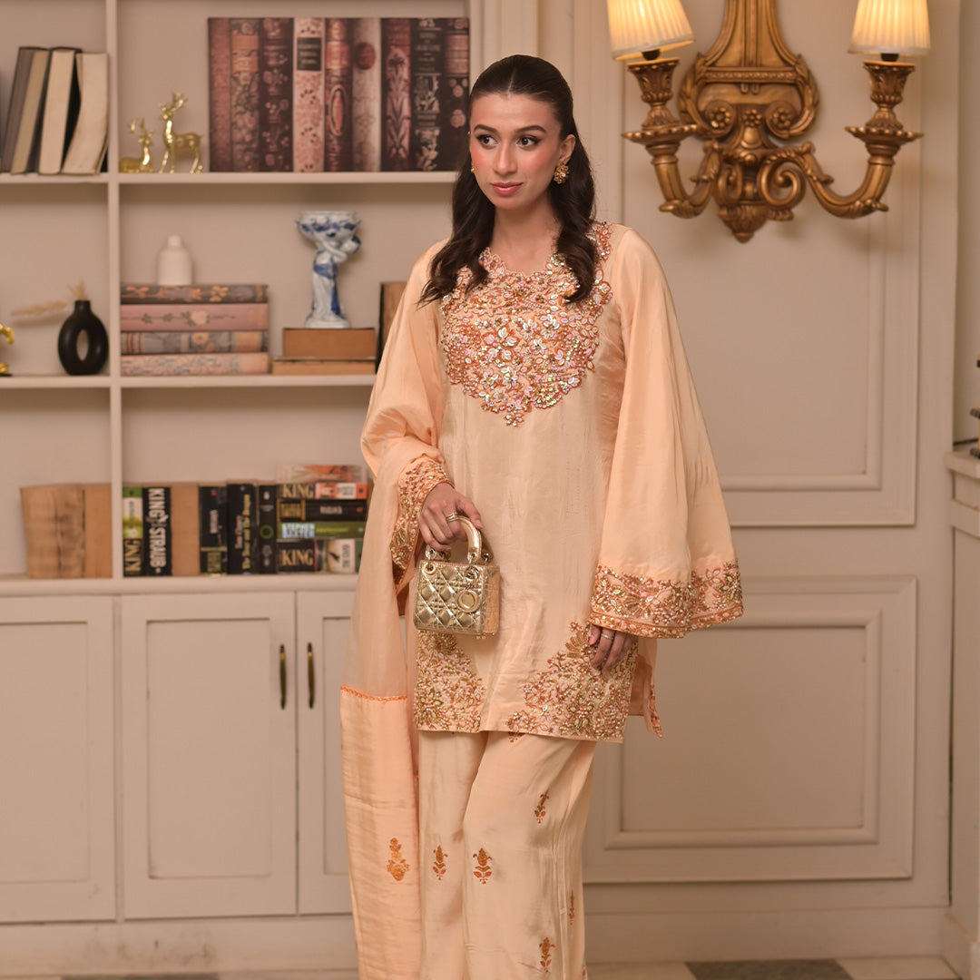 On pure tussle silk with hand embroidery and embellishment paired with block printed organza dupatta and flared pants