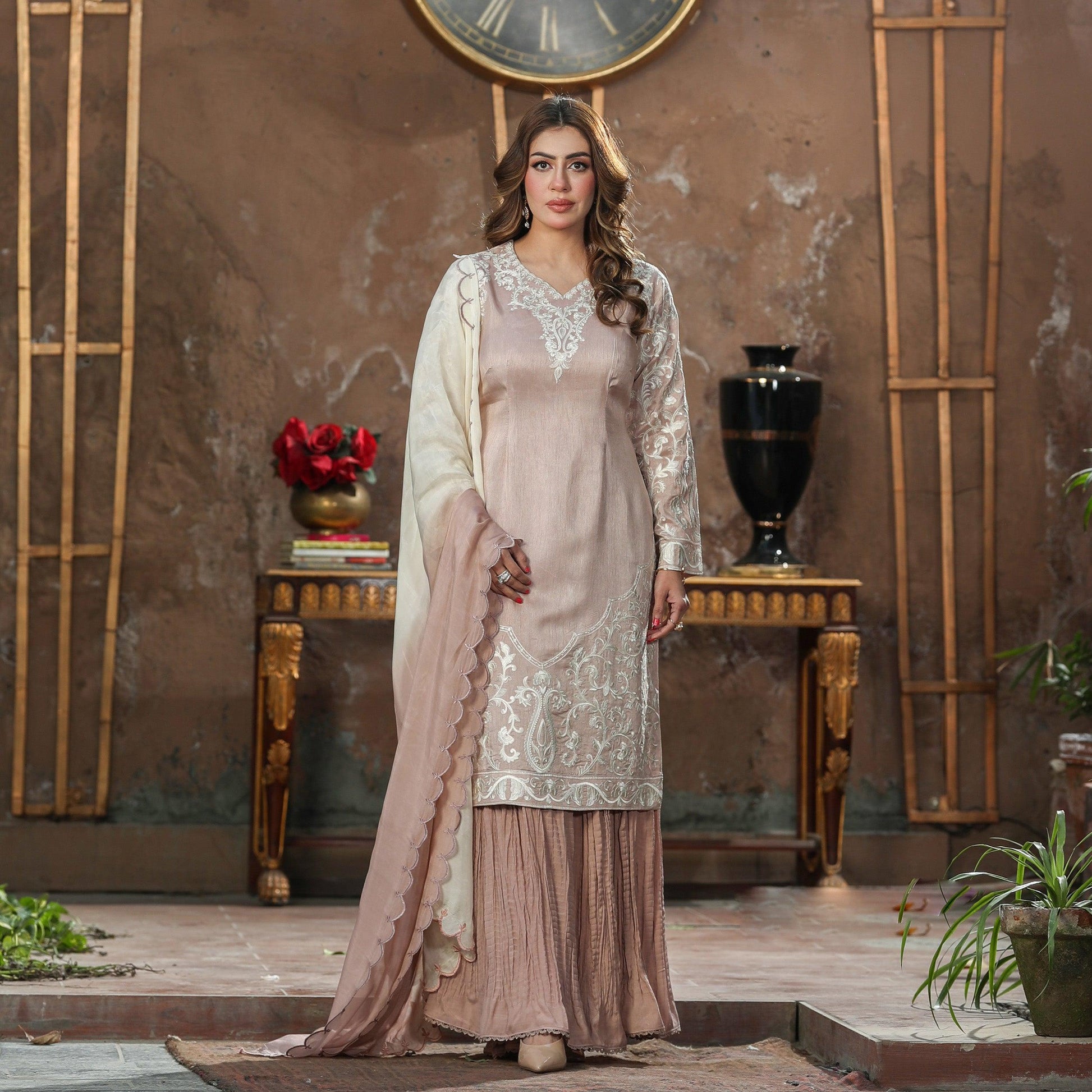 korean silk fabric dress MEHRUNISA Fabric : Korean Raw silk Colour: Pink Work details: Hand Embroidery and Embellished Definitely for the bell of the ball. A stunning choli is a masterpiece of handwork, adorned with sitara,