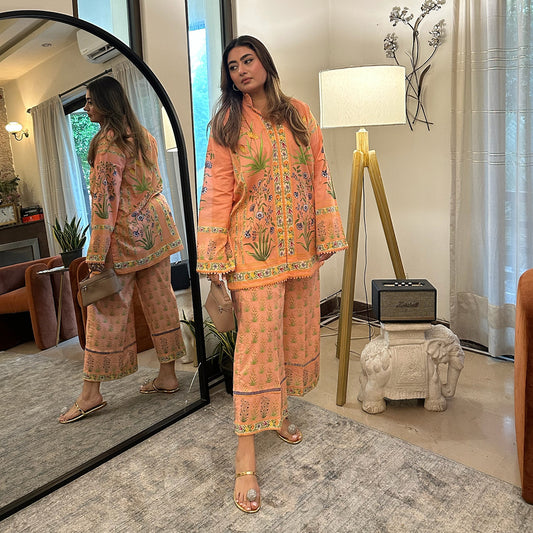 Our Peach Colour Floral Lawn Cord Set is a treat for the Eyes.